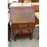 A MID 20TH CENTURY OAK BUREAU ON OPEN BASE, 21" WIDE