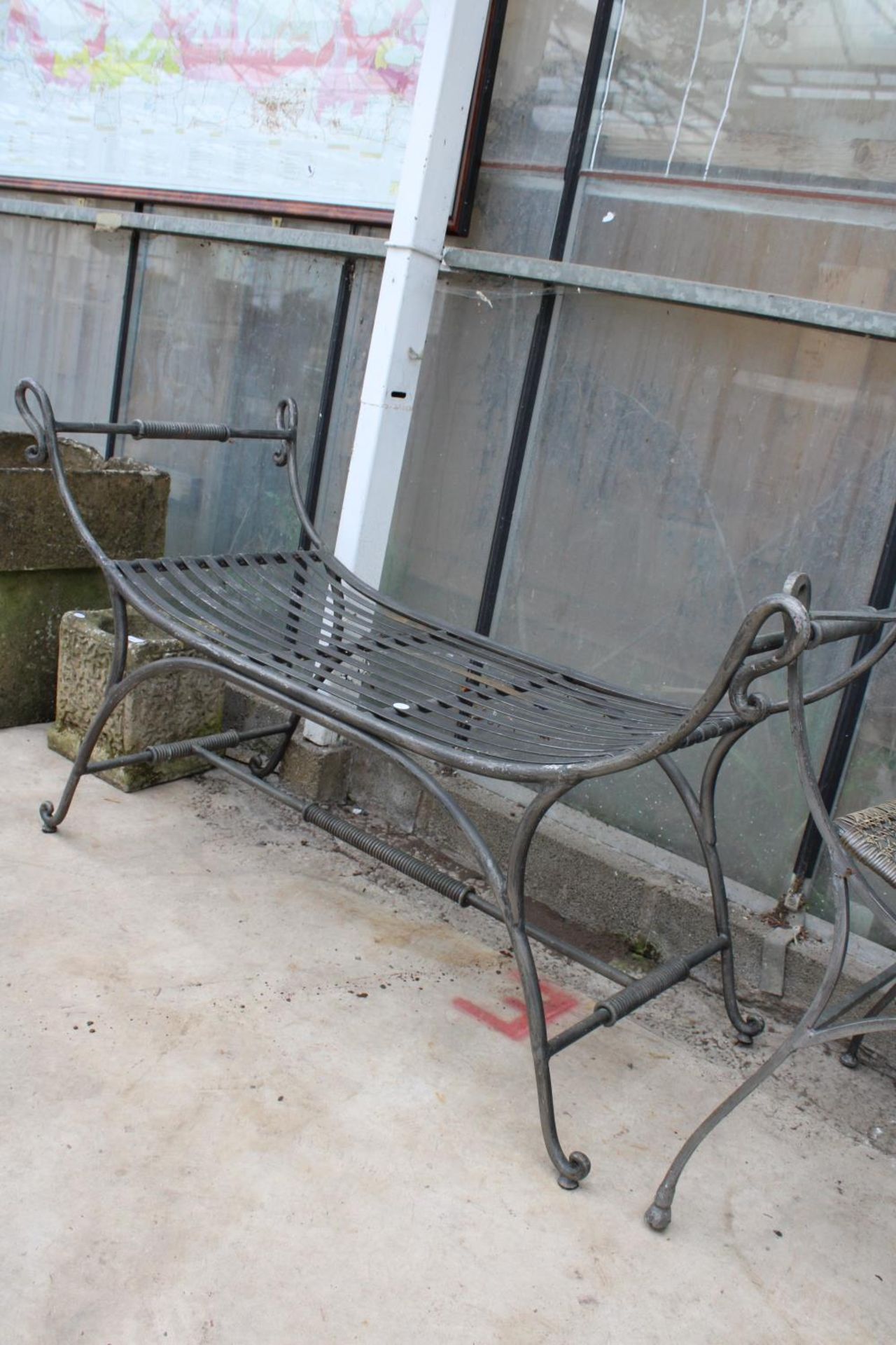 A METAL GARDEN CHAIR WITH RATTAN SEAT AND BACK AND A SIMILAR HEAVY METAL BENCH - Image 3 of 3