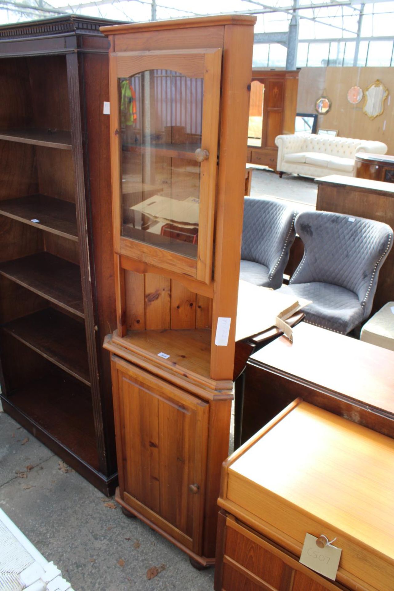 A MODERN PINE CORNER CUPBOARD WITH GLAZED UPPER PORTION