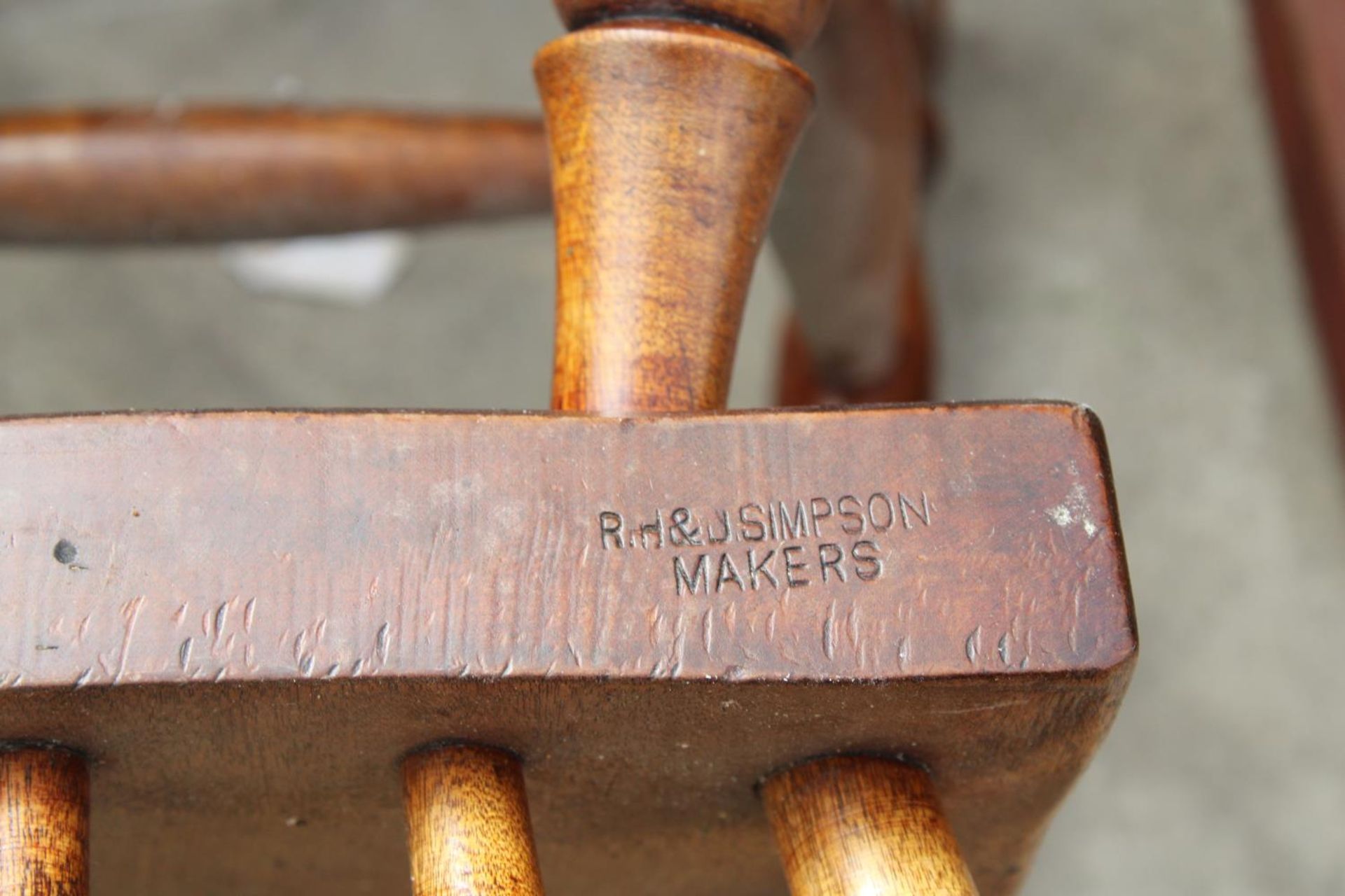 A VICTORIAN STYLE ELM AND BEECH CHILDS ROCKING CHAIR STAMPED R.H. & J. SIMPSON (MAKERS) - Image 3 of 3