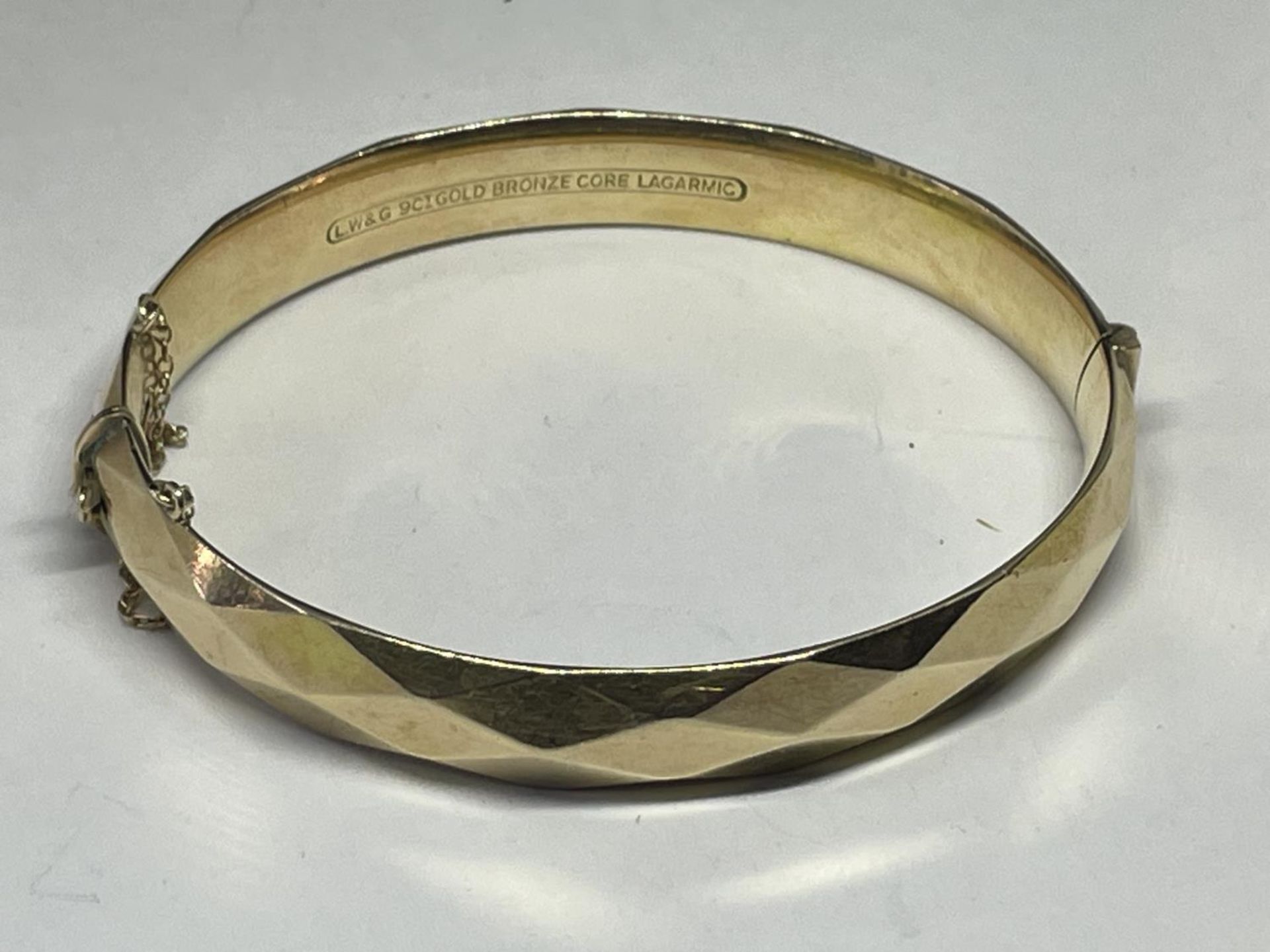A GOLD PLATED BANGLE