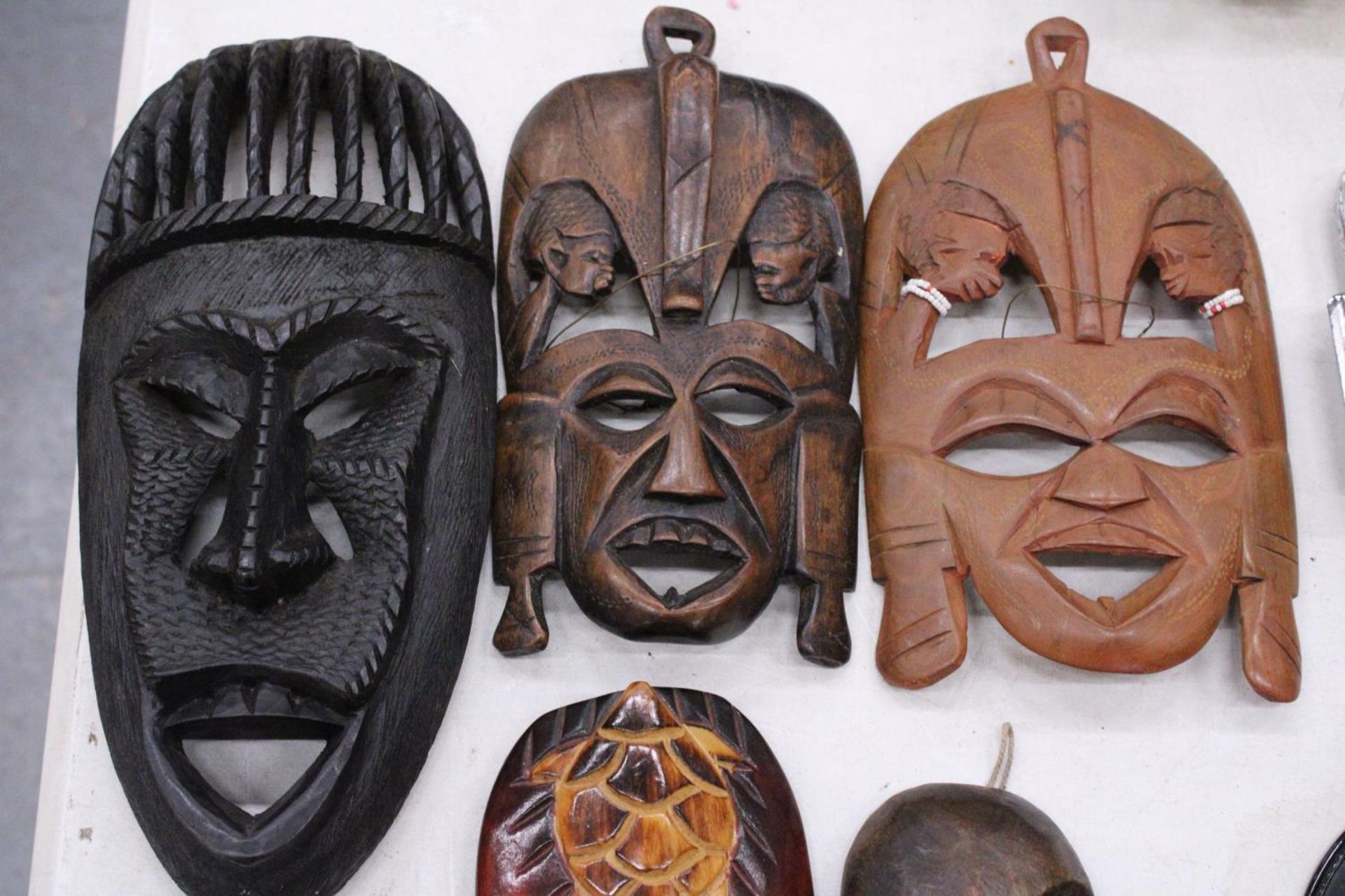 FIVE AFRICAN HAND CARVED WOODEN MASKS - PLUS TWO SPEARS - Image 2 of 5