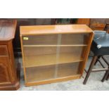 A RETRO OAK BOOKCASE WITH TWO SLIDING DOORS 36" WIDE