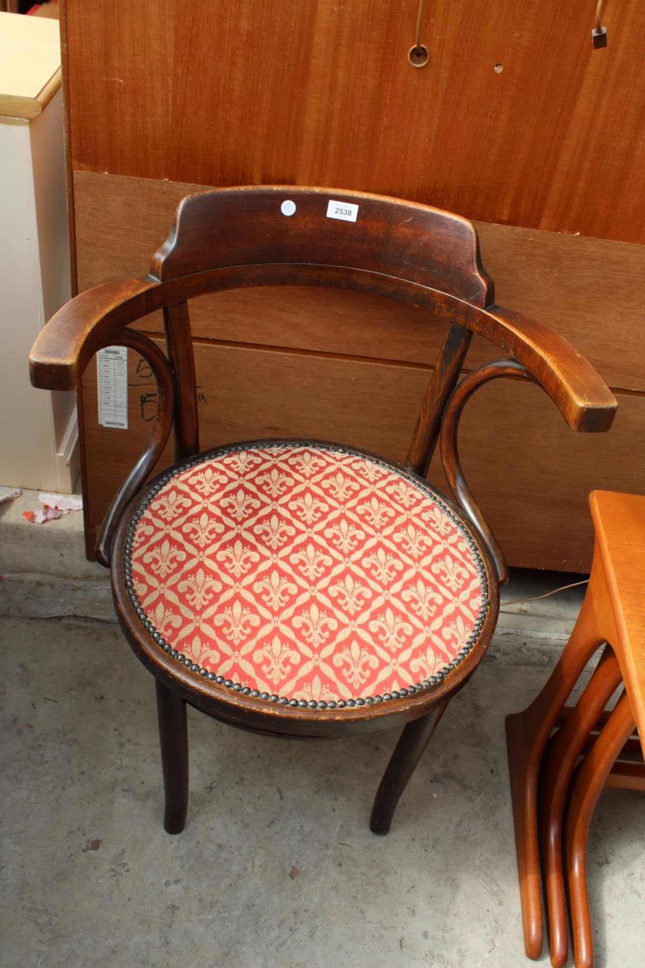 A LOW BENTWOOD ELBOW CHAIR