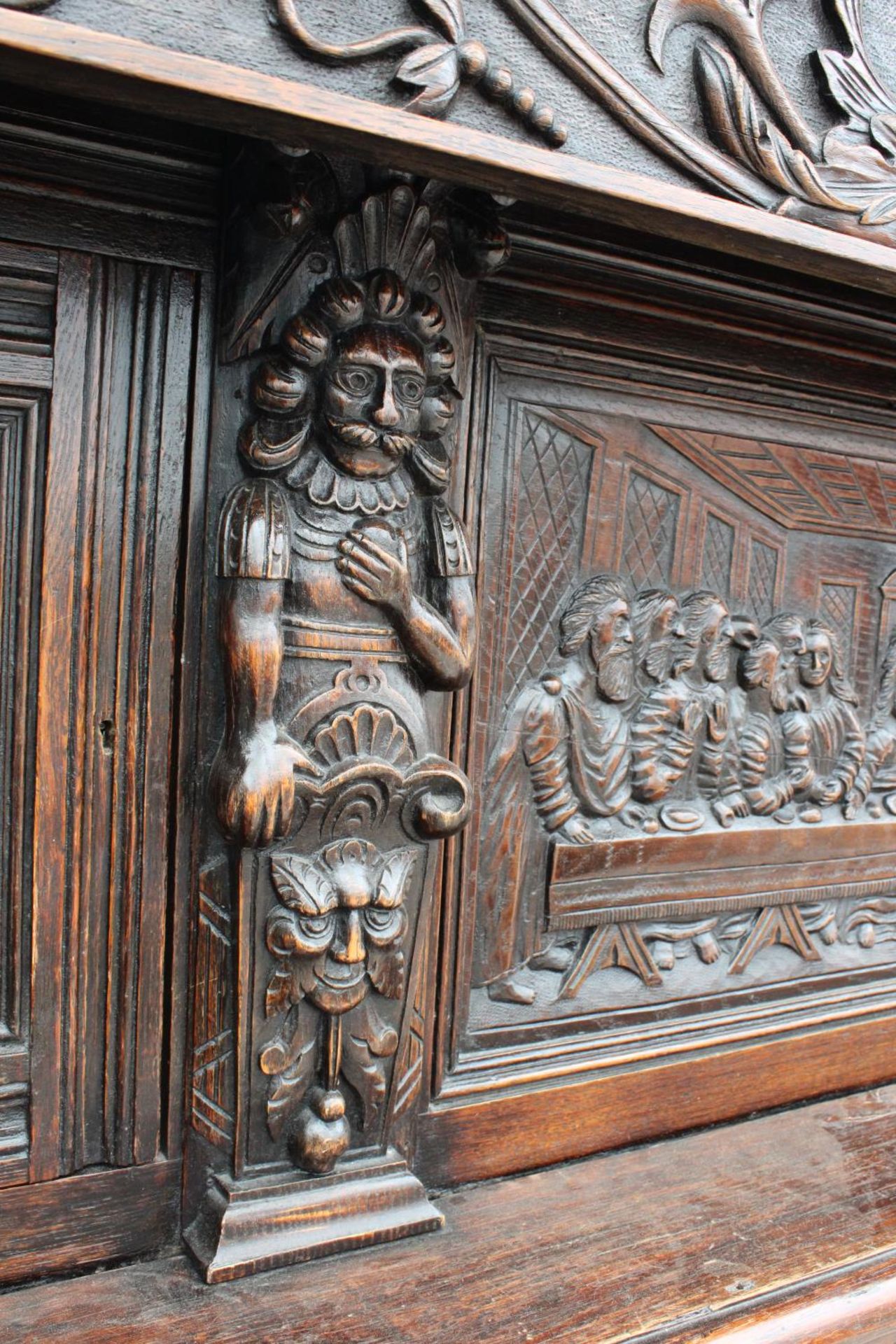 AN OAK GEORGE III STYLE COURT CUPBOARD WITH CARVED PANELS, THREE DEPICTING THE BIRTH AND - Image 10 of 13