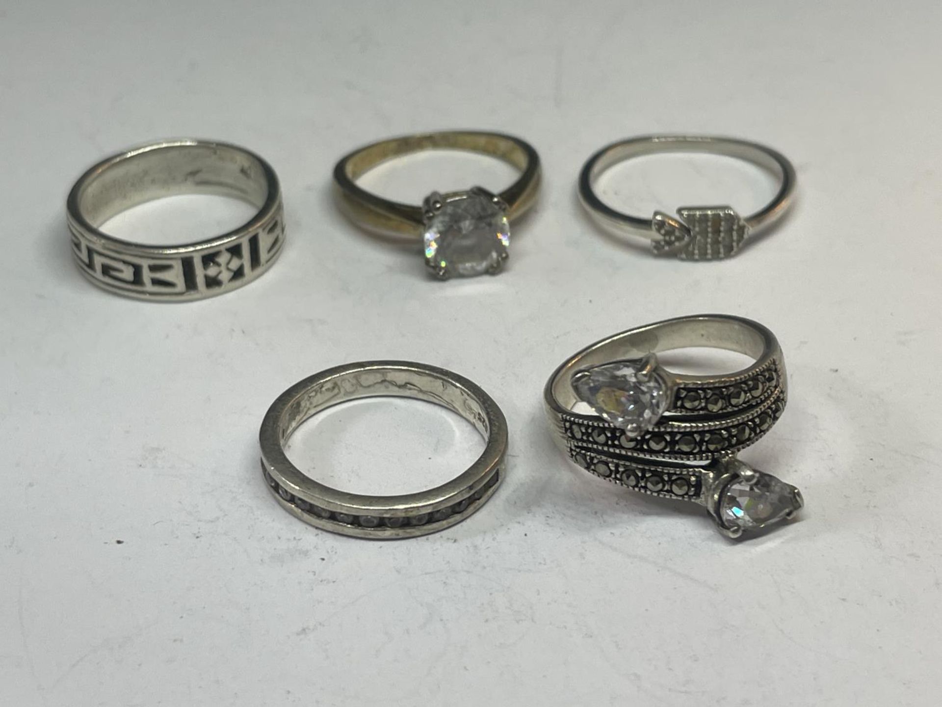 FIVE SILVER RINGS