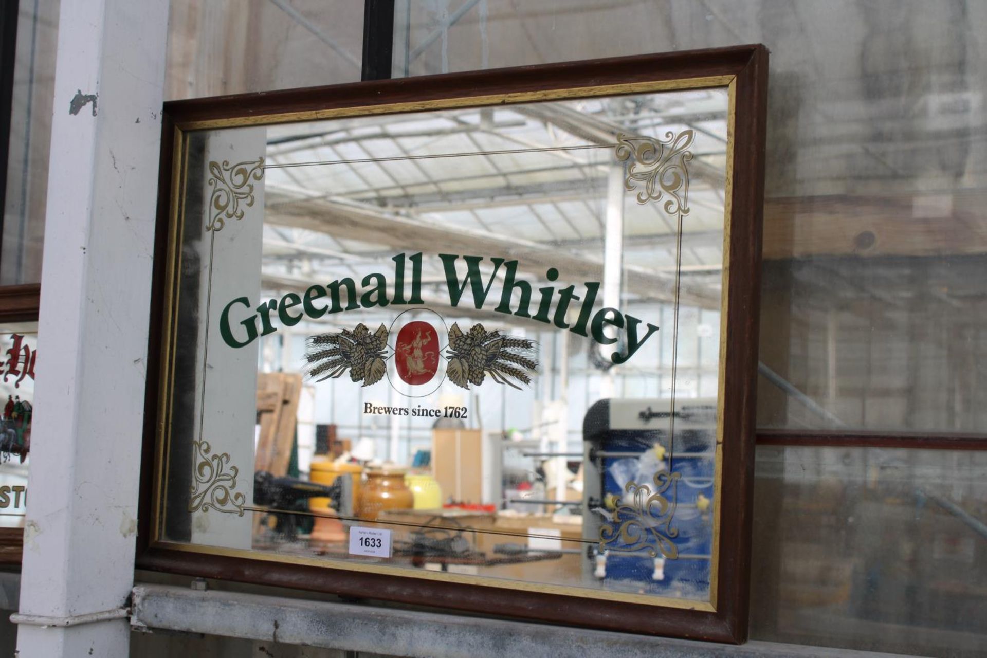 A FRAMED MONOGRAMED 'GREENALL WHITLEY' MIRROR