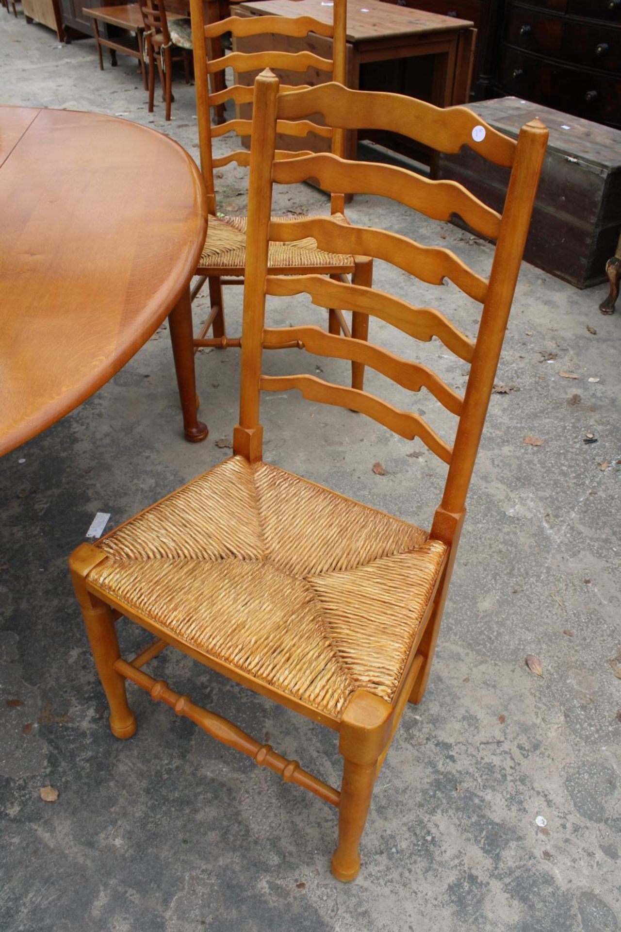 A GEORGIAN STYLE OVAL OAK WAKES TABLE, 77" X 59" OPENED AND SIX LADDER BACK DINING CHAIRS WITH - Image 8 of 9
