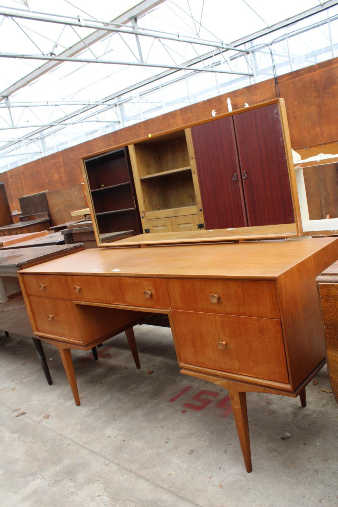 A MCINTOSH RETRO TEAK DRESSING TABLE ENCLOSING FIVE DRAWERS, 55.5" WIDE ON TAPERING LEGS - Image 2 of 4