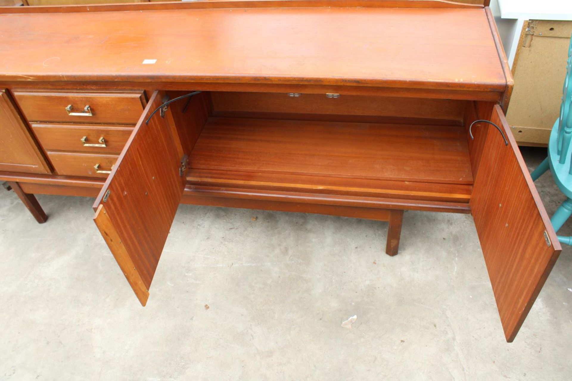 A RETRO TEAK SIDEBOARD ENCLOSING THREE DRAWERS AND THREE CUPBOARDS, 78" WIDE - Image 4 of 4