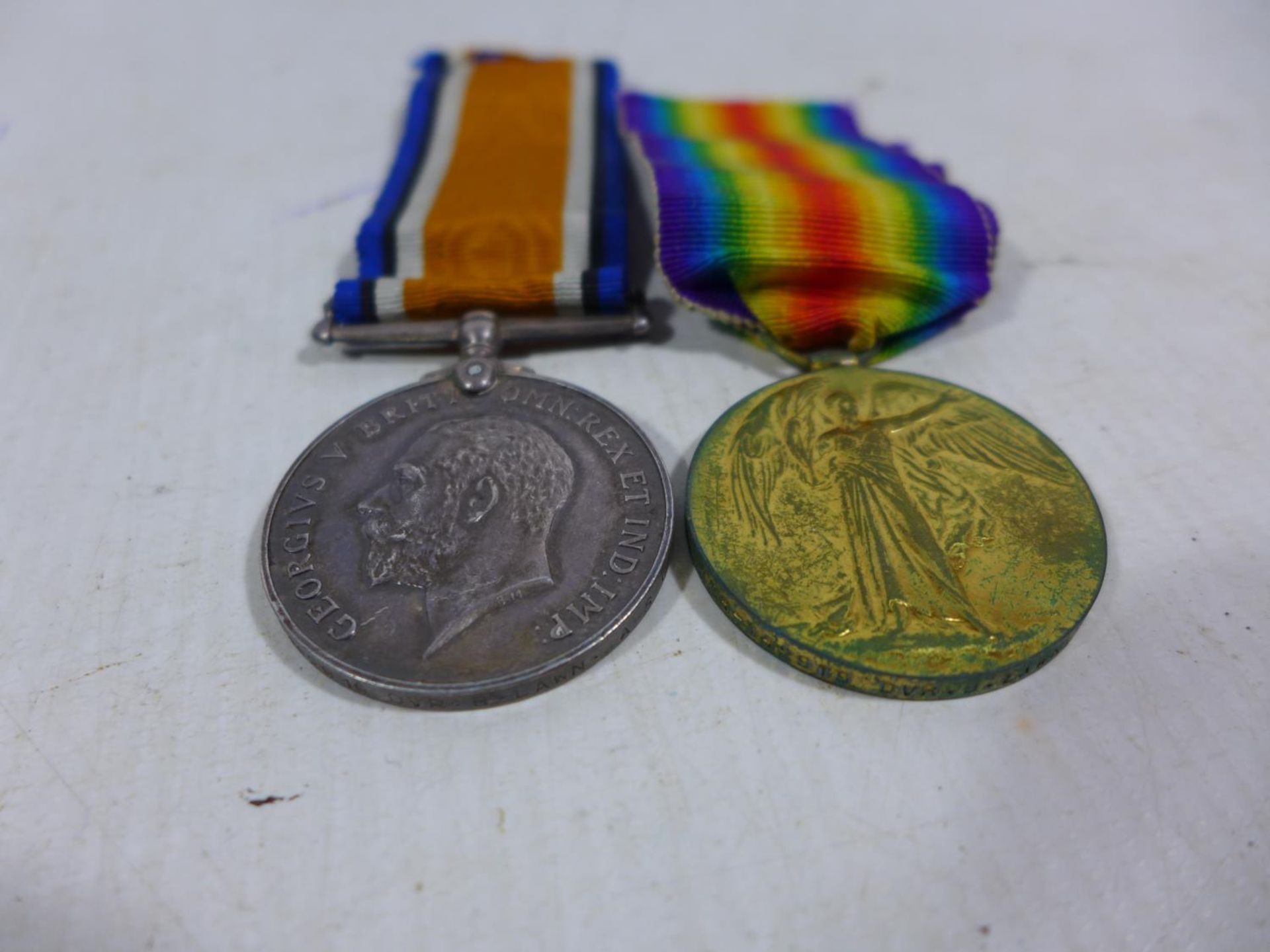 A WORLD WAR I MEDAL PAIR AWARDED TO T4 142919 DRIVER B LAWN ARMY SERVICES CORPS