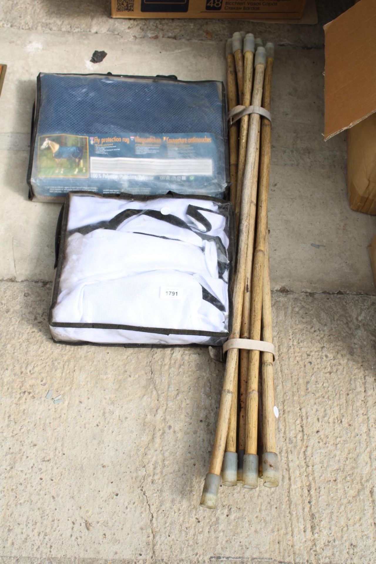 A SET OF DRAINING RODS AND TWO FLY PROTECTION HORSE RUGS
