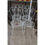 A SET OF FOUR ORNATE AND DECORATIVE WIRE FRAMED BISTRO CHAIRS