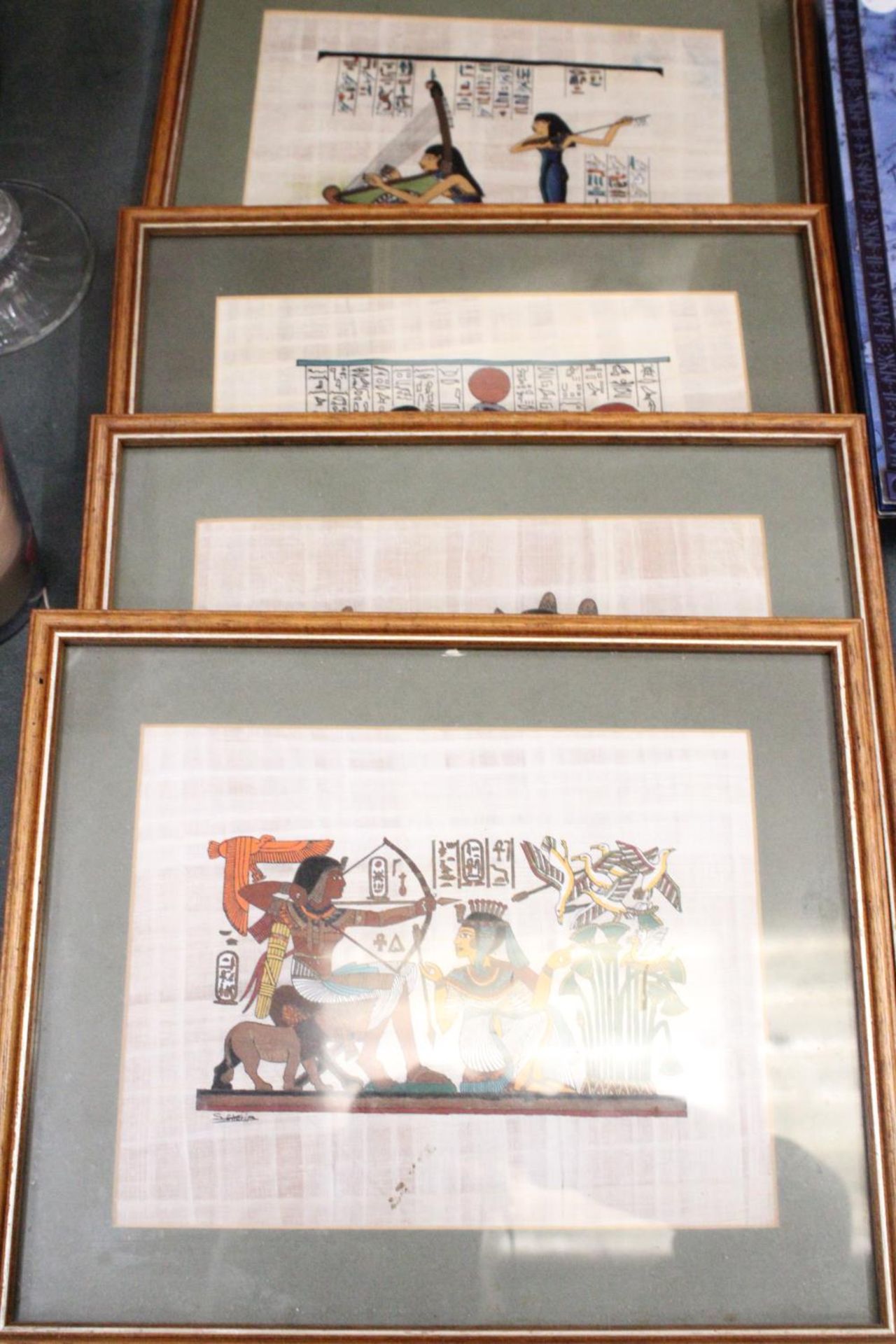 FOUR FRAMED ANCIENT EGYPTIAN DEPICTIONS ON COTTON