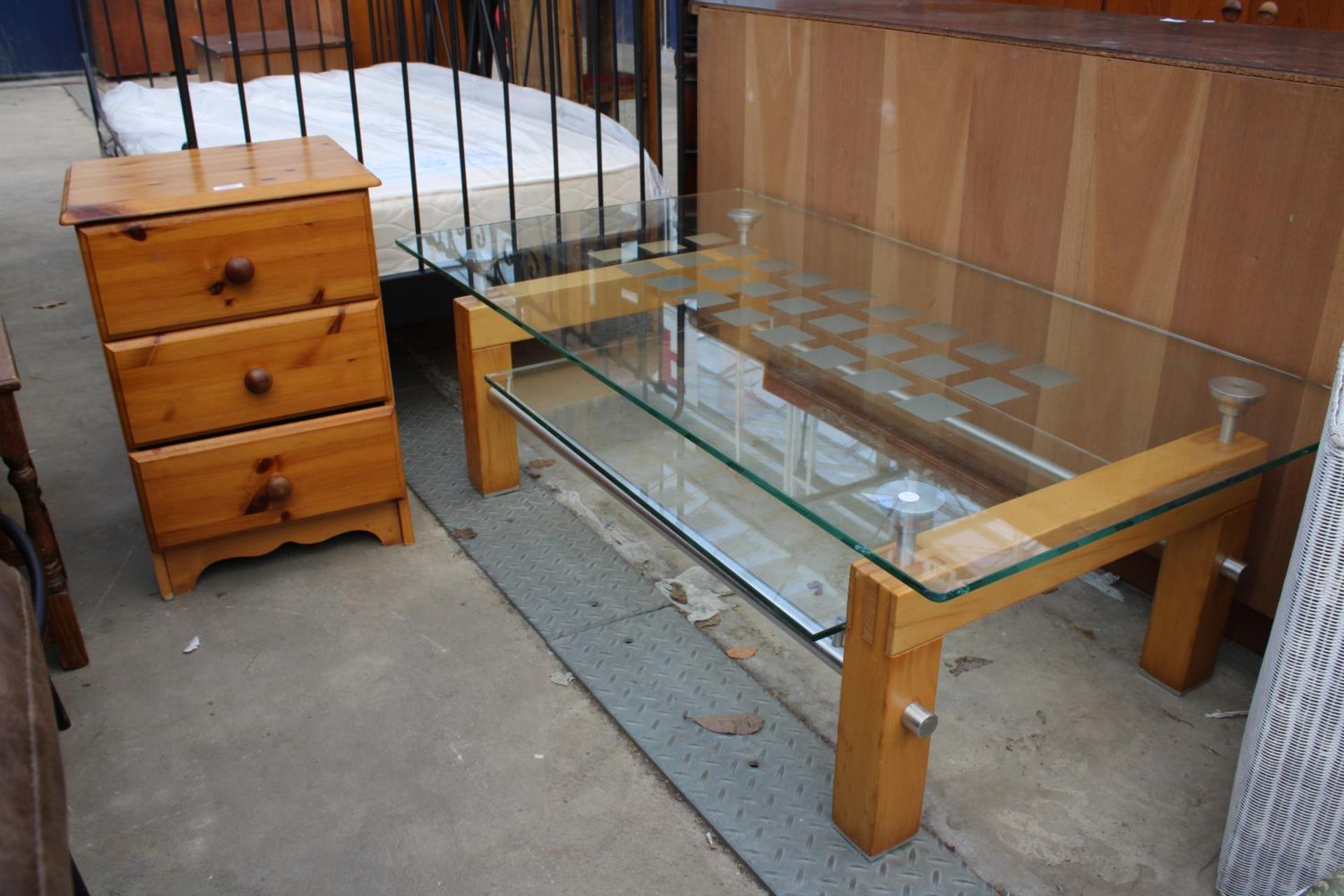 A MODERN PINE BEDSIDE CHEST AND TWO TIER GLASS COFFEE TABLE
