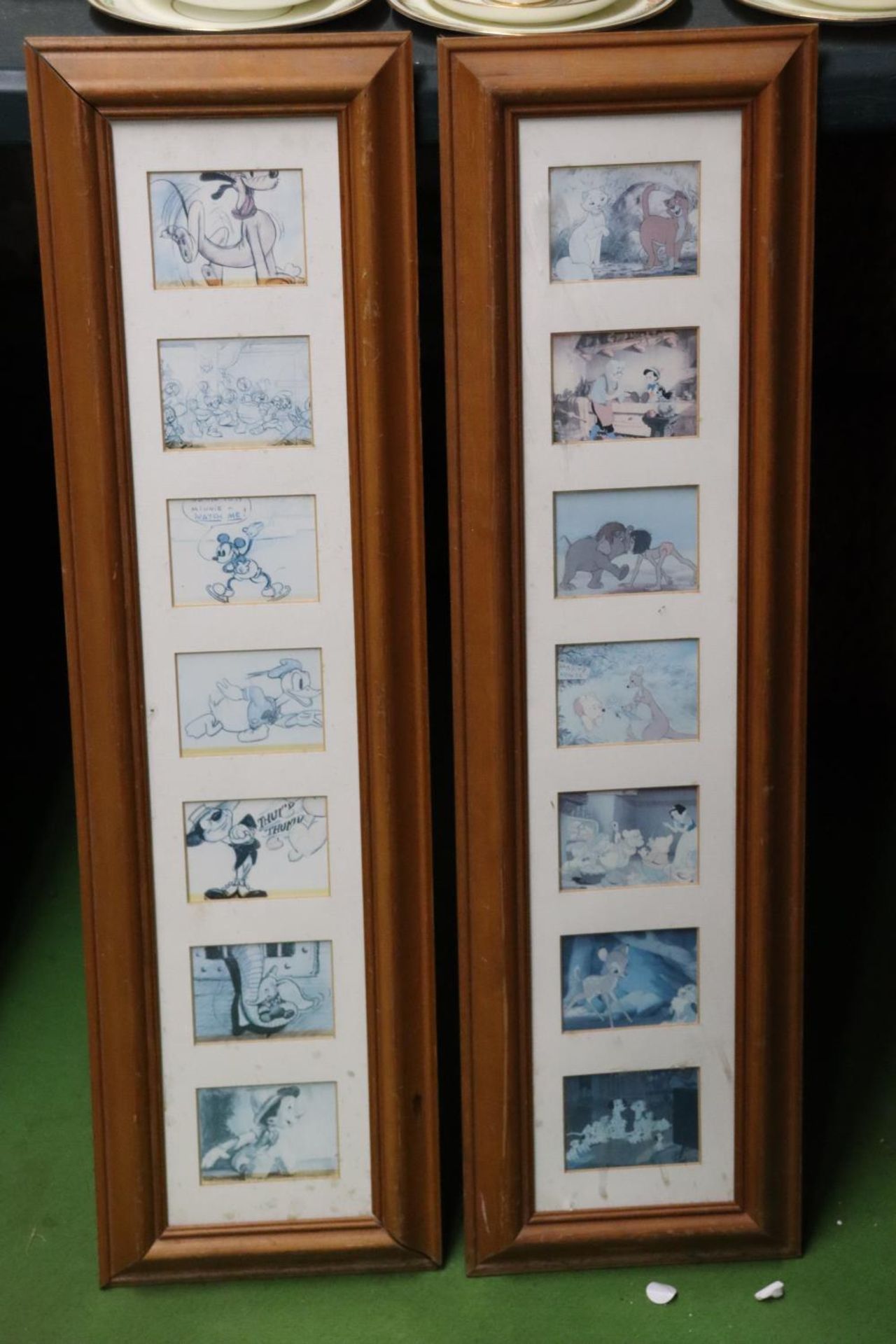 A PAIR OF DISNEY CARTOON SLIDES IN PINE FRAMES