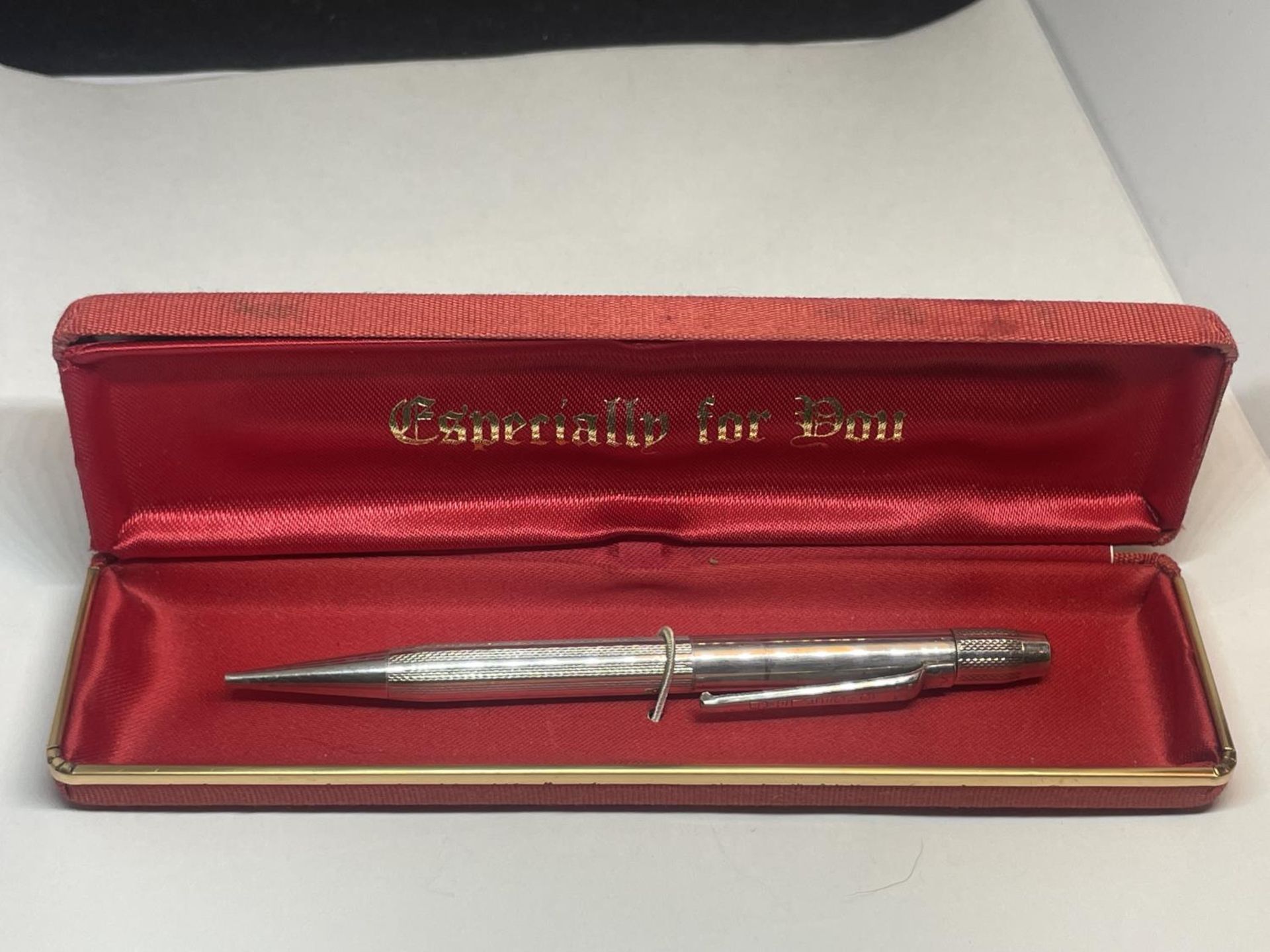 A SILVER YARD OF LEAD PENCIL IN A PRESENTATION BOX