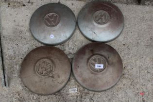 A SET OF FOUR VINTAGE VW HUB CAPS