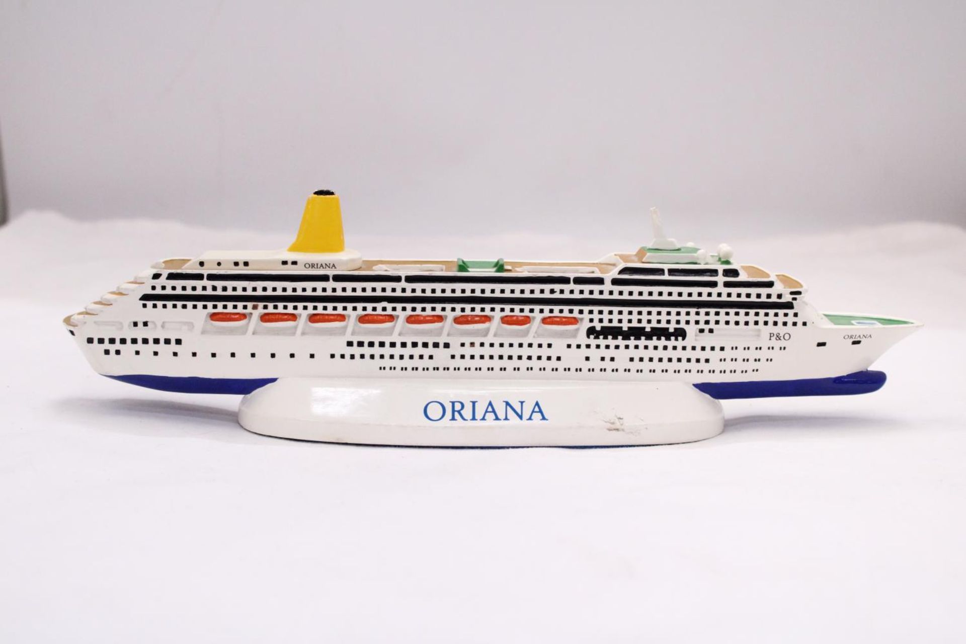 A HEAVY, SOLID, OCEAN LINER ON A STAND, 'ORIANA', LENGTH 30CM, HEIGHT 6CM