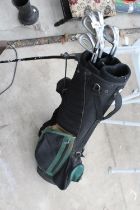 A GOLF BAG WITH AN ASSORTMENT OF GOLF CLUBS