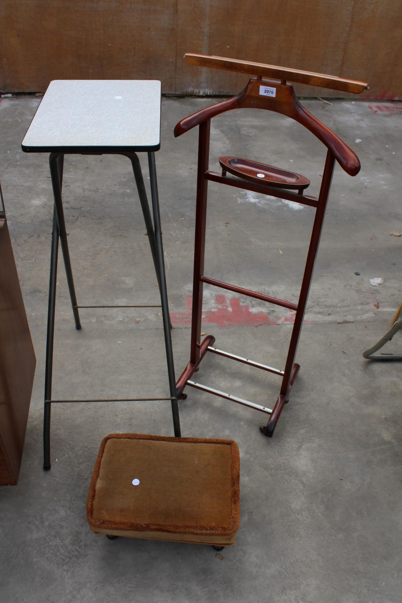 THREE ITEMS TO INCULE AN UPHOLSTERED FOOTSTOOL, A MAHOGANY SUIT STAND AND A TALL SIDE TABLE