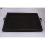 A WOODEN SERVING TRAY WITH METAL HANDLES MARKED - ST DUNSTANS