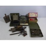 A COLLECTION OF GUN CLEANING EQUIPMENT, AIR RIFLE SPRINGS, OIL BOTTLES ETC