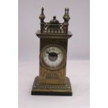 A VINTAGE BRASS MANTEL CLOCK ON A MARBLE BASE, WITH FOUR SPIRES TO THE TOP. WORKING WHEN