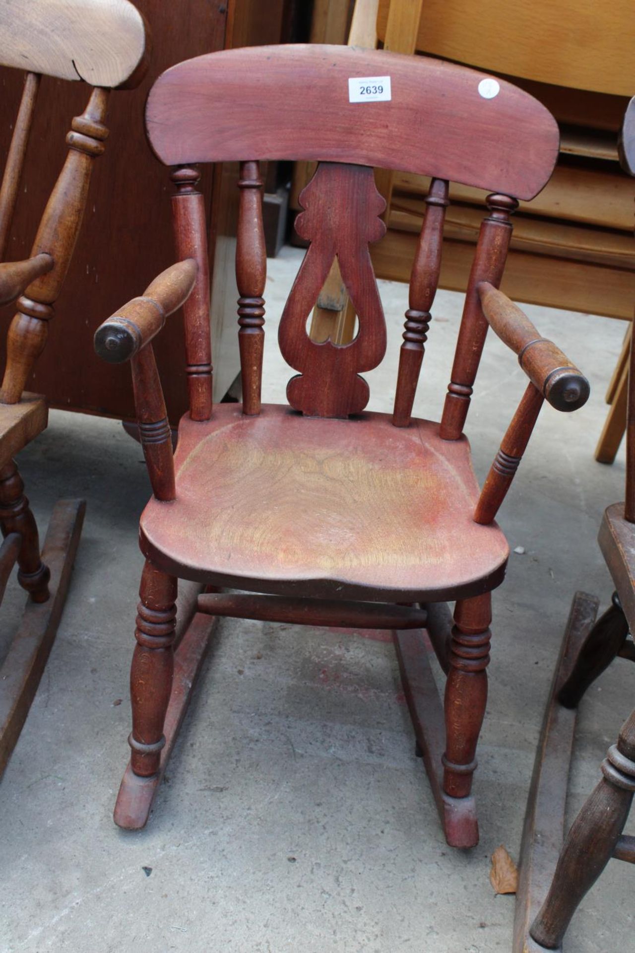 A VICTORIAN STYLE ELM AND BEECH CHILDS ROCKING CHAIR