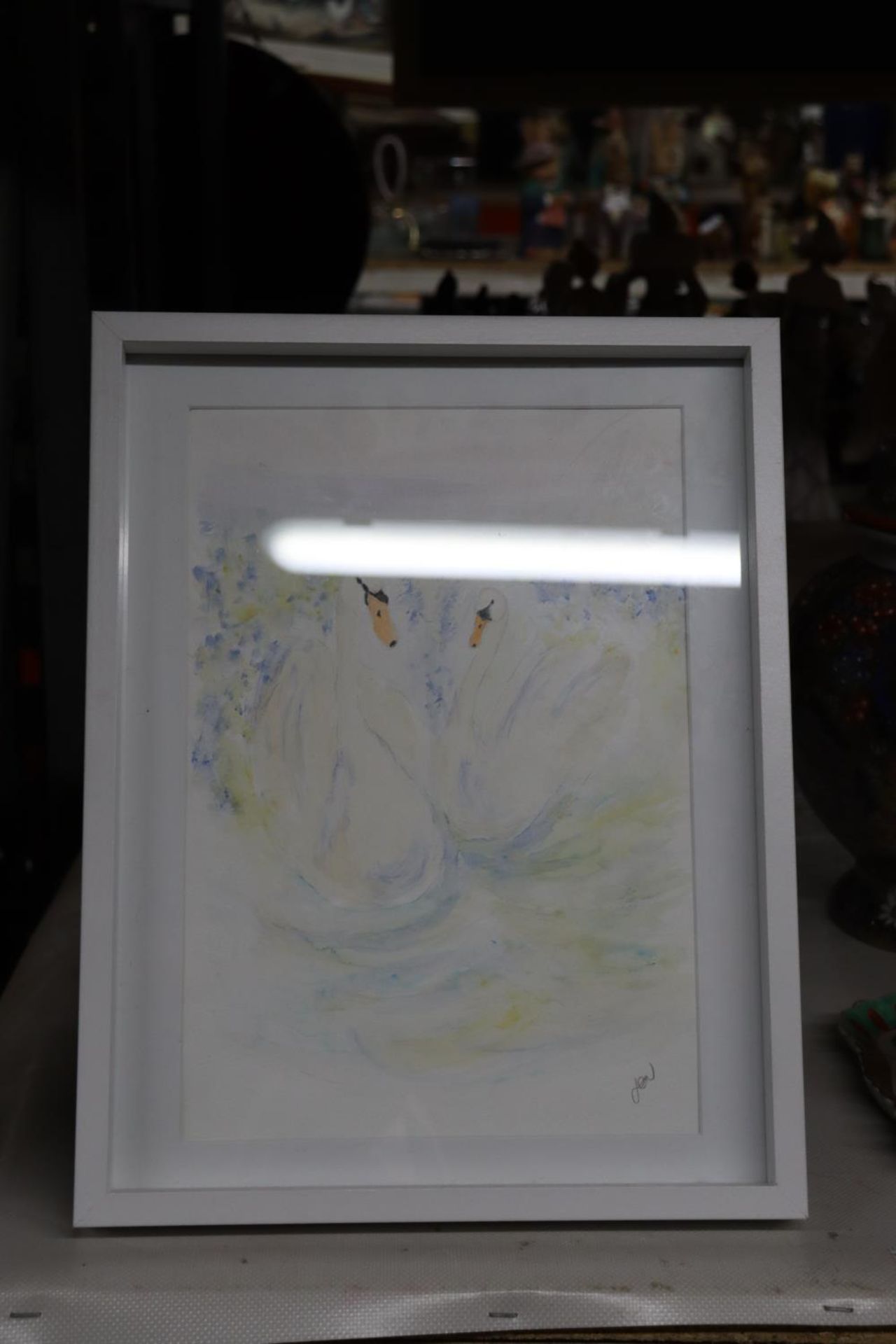 A SIGNED WATERCOLOUR OF TWO SWANS BY JEN