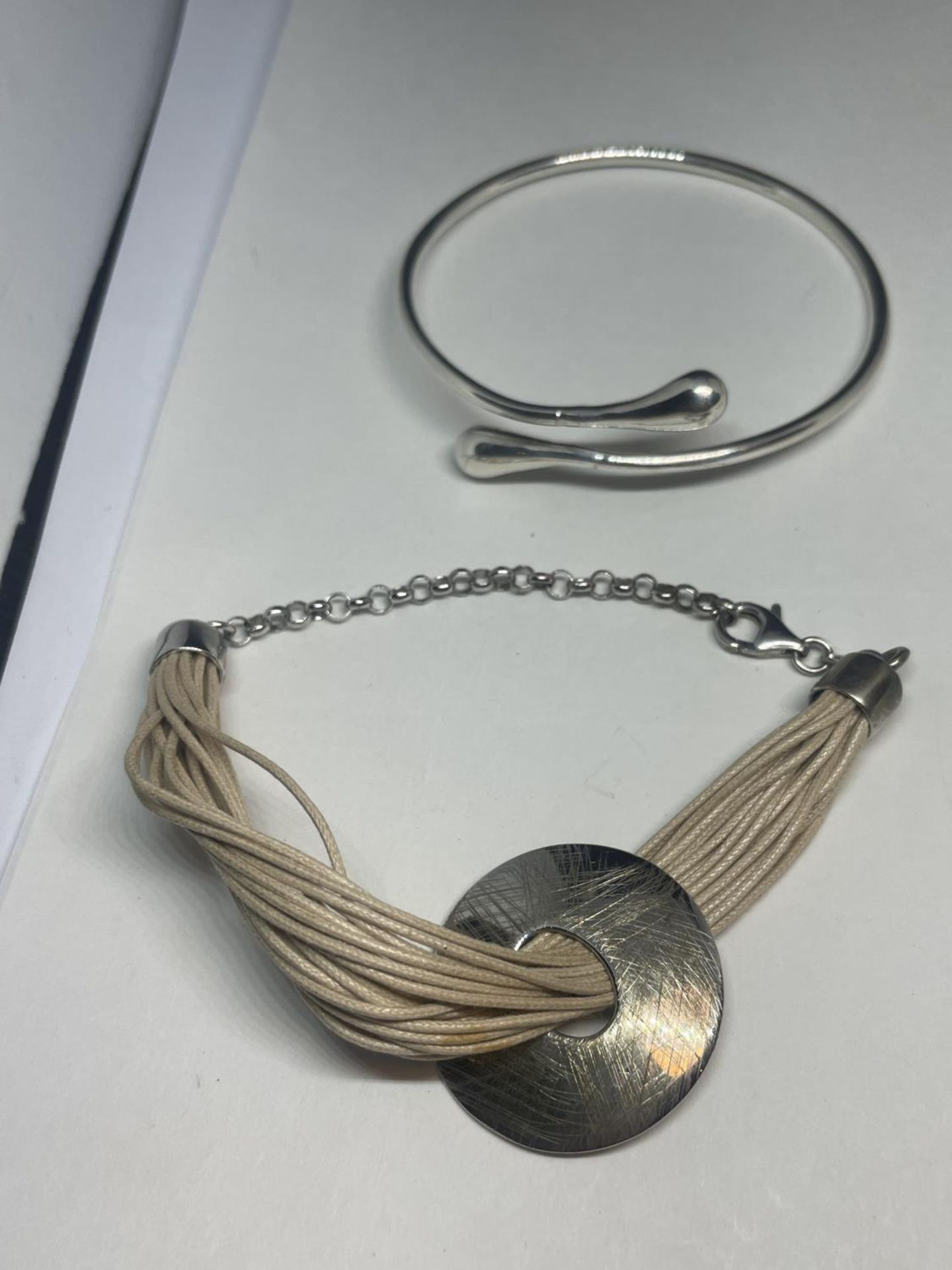 THREE SILVER BRACELETS AND A SILVER BANGLE - Image 2 of 3