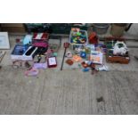 AN ASSORTMENT OF ITEMS TO INCLUDE TOYS, COSTUME JEWELLERY AND BOOKS ETC
