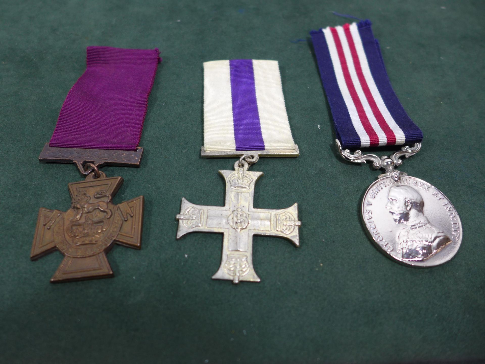 THREE REPLICA MEDALS, TO INCLUDE VICTORIA CROSS, MILITARY CROSS AND A MILITARY MEDAL