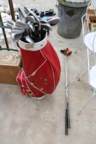 A GOLF BAG WITH AN ASSORTMENT OF GOLF CLUBS