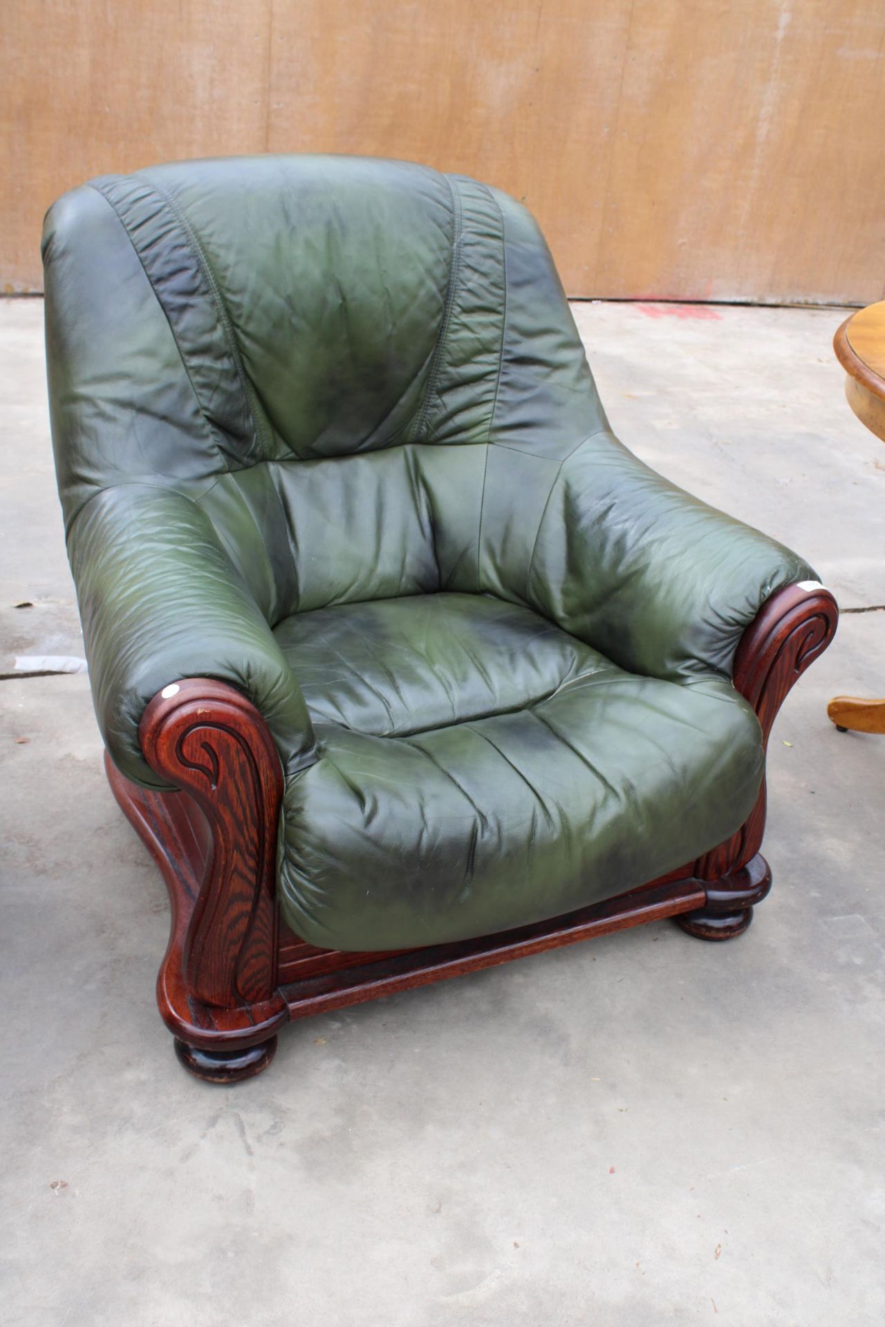 A MODERN GREEN RECOR (BELGIUM) FAUX LEATHER EASY CHAIR IN WOODEN FRAME