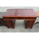 A REPRODUCTION MAHOGANY TWIN PEDESTAL DESK WITH INSET LEATHER TOP ENCLOSING SIX DRAWERS AND THREE