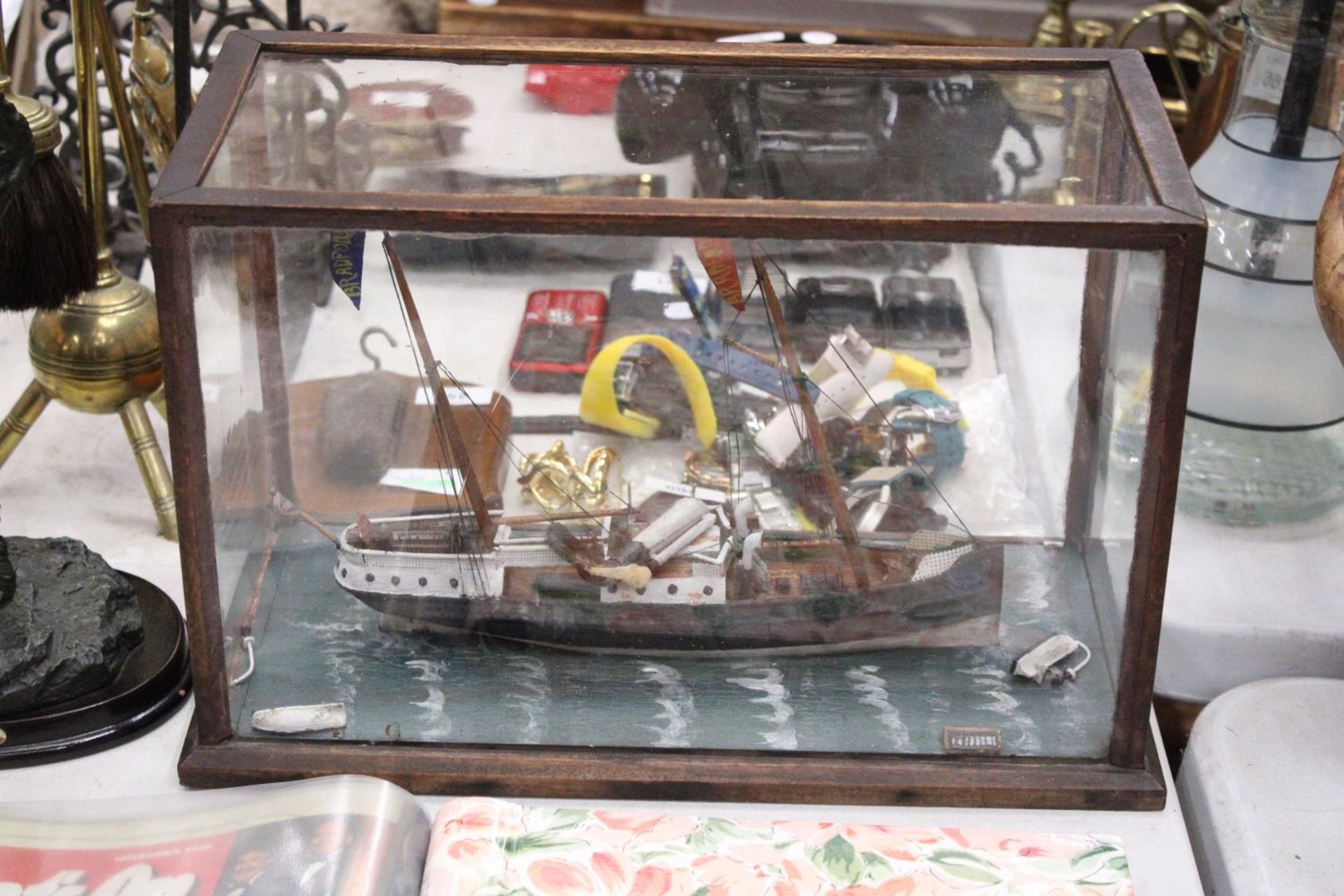 A VICTORIAN SHIPWRECK, SHIP IN A GLASS CASE, 'THE BRADFORD', LENGTH 37CM, HEIGHT 25CM, DEPTH 18CM