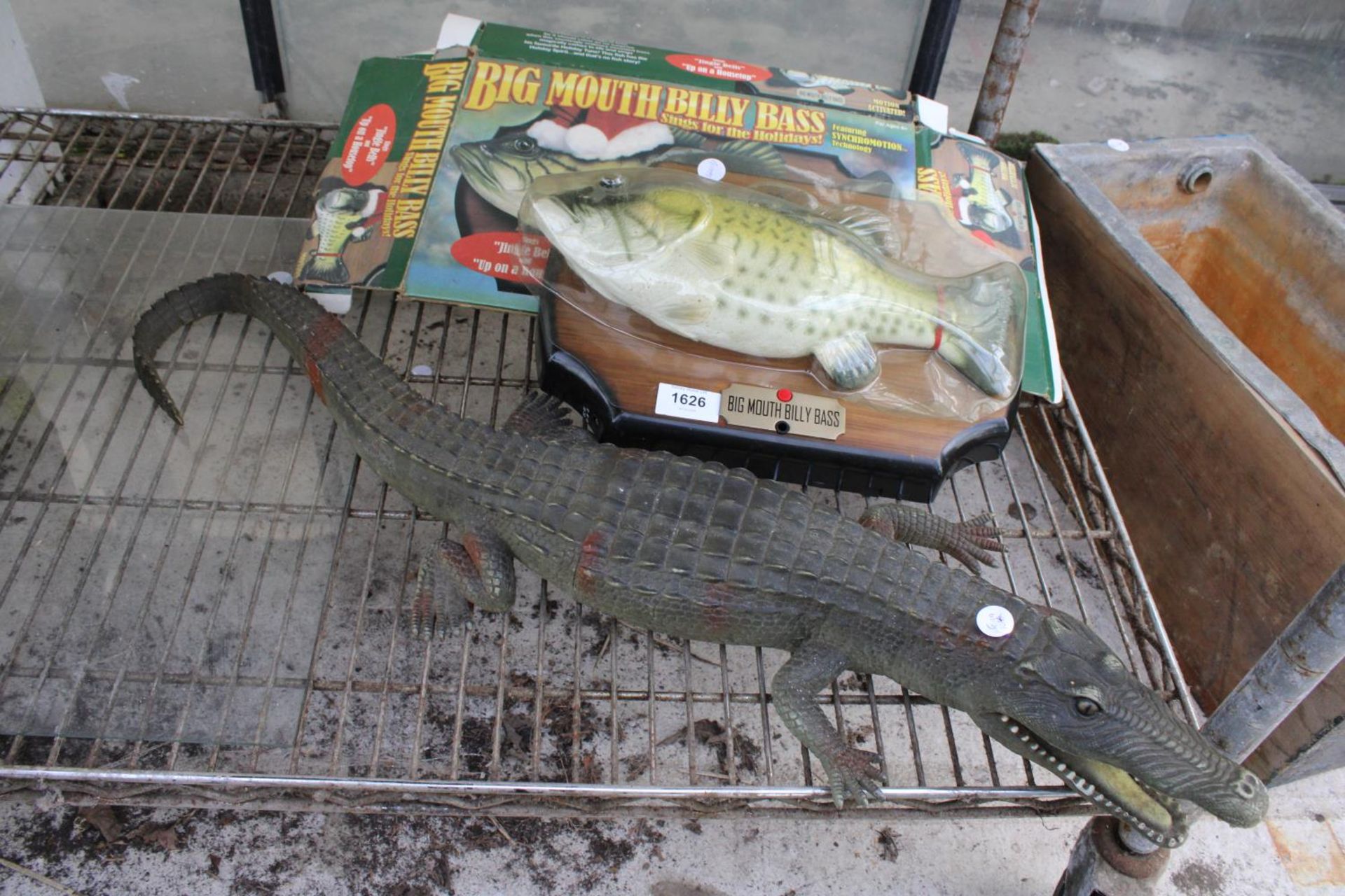 A LARGE PLASTIC ALIGATOR AND AN ELECTRIC BIG MOUTH BILLY BASS