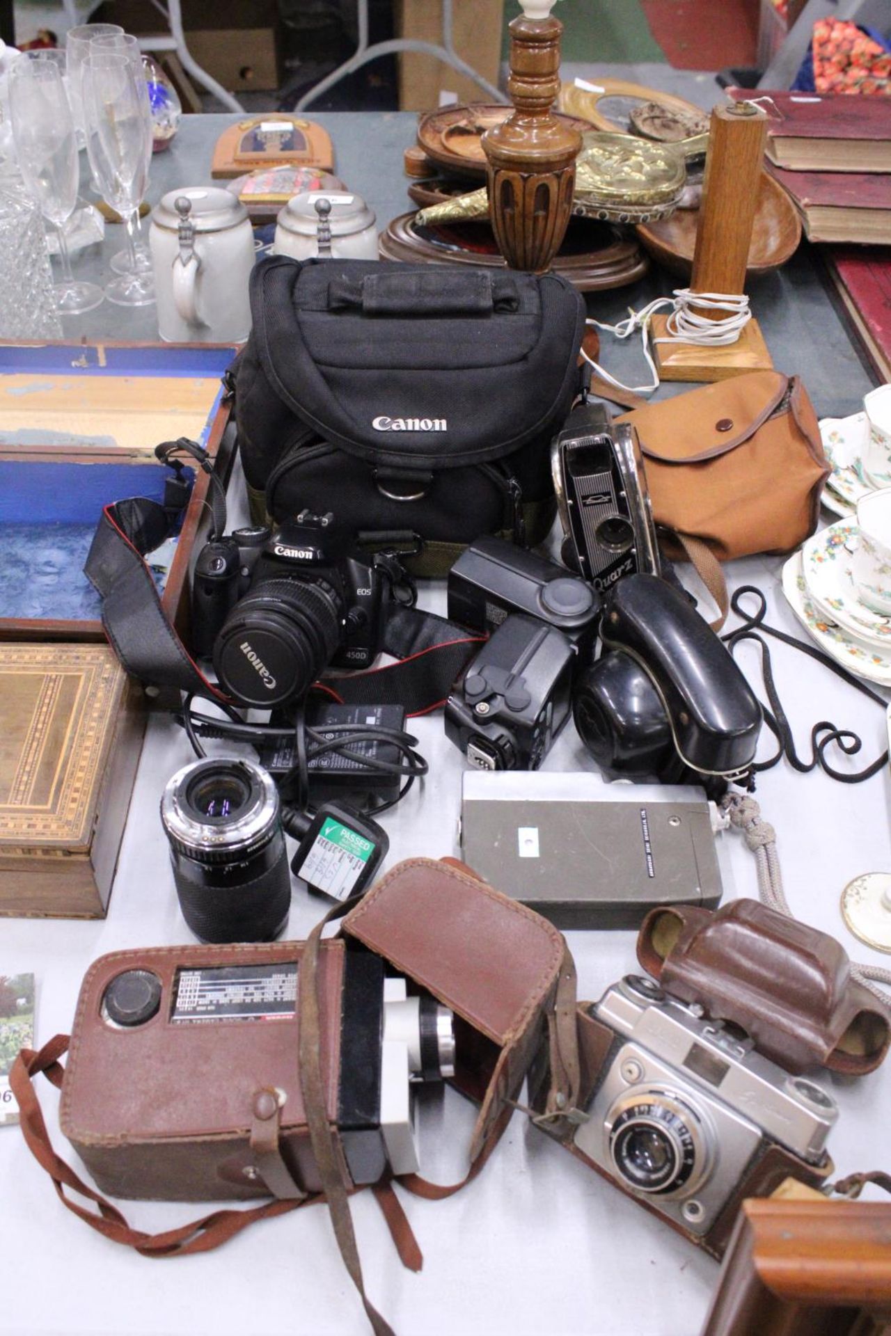 A COLLECTION OF CAMERAS TO INCLUDE A CANON EOS WITH BATTERY PACK, LENS AND BAG, PLUS A VINTAGE