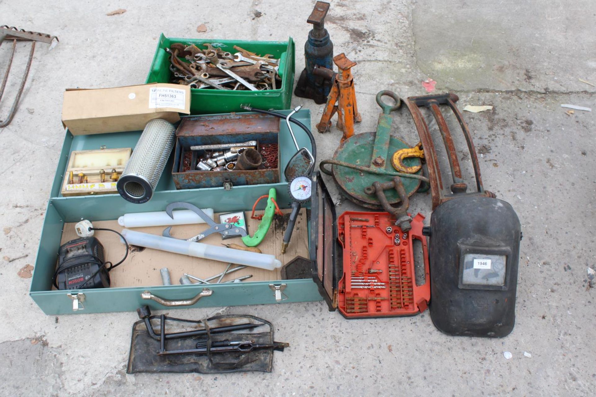 AN ASSORTMENT OF TOOLS TO INCLUDE SPANNERS, A WELDING MASK AND A PULLEY WHEEL ETC