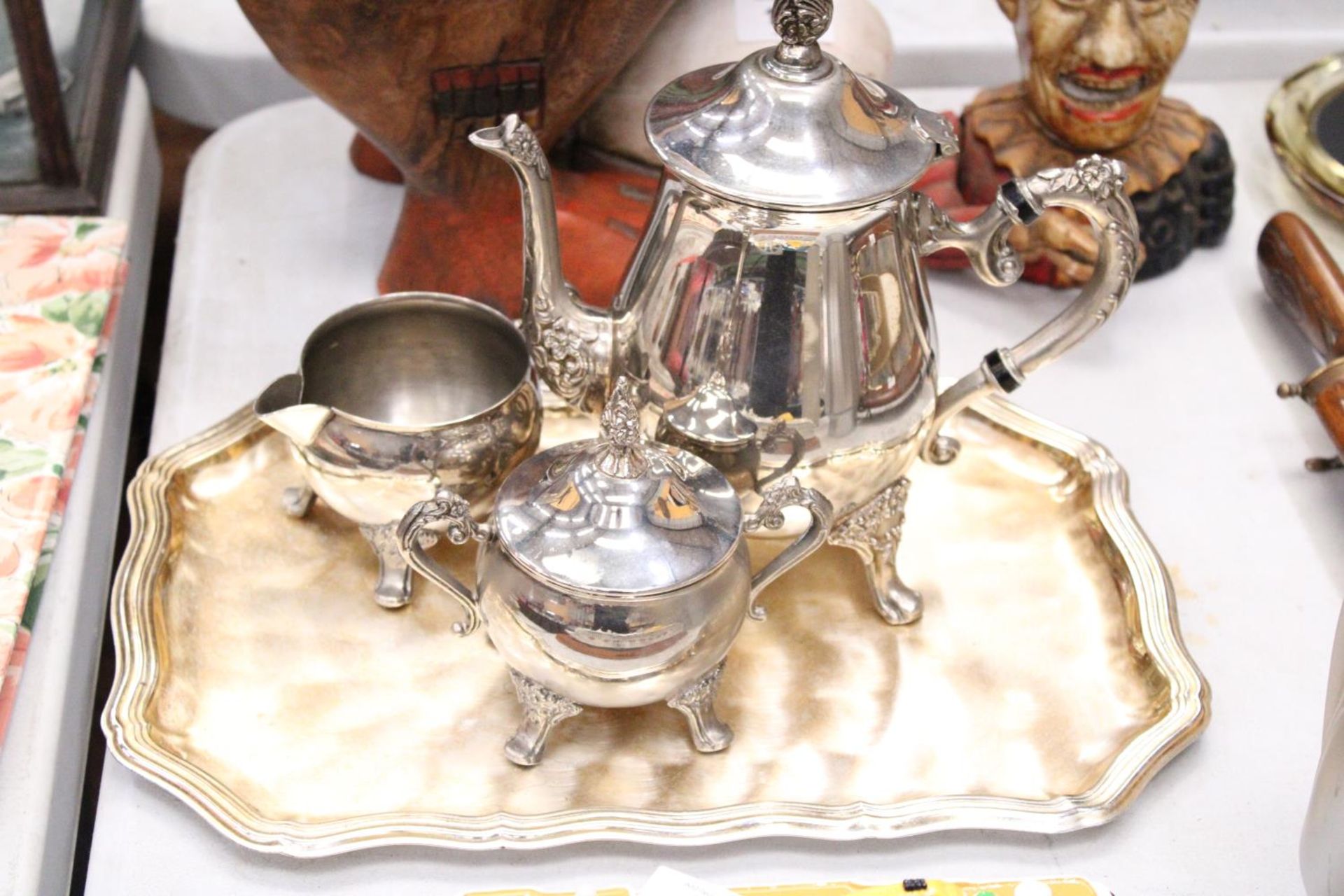 A VINTAGE SILVER PLATED COFFEE POT, MILK JUG AND SUGAR BOWL ON A TRAY