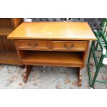 A SMALL OAK LOW SIDE-TABLE ENCLOSING 2 DRAWERS, 32" WIDE