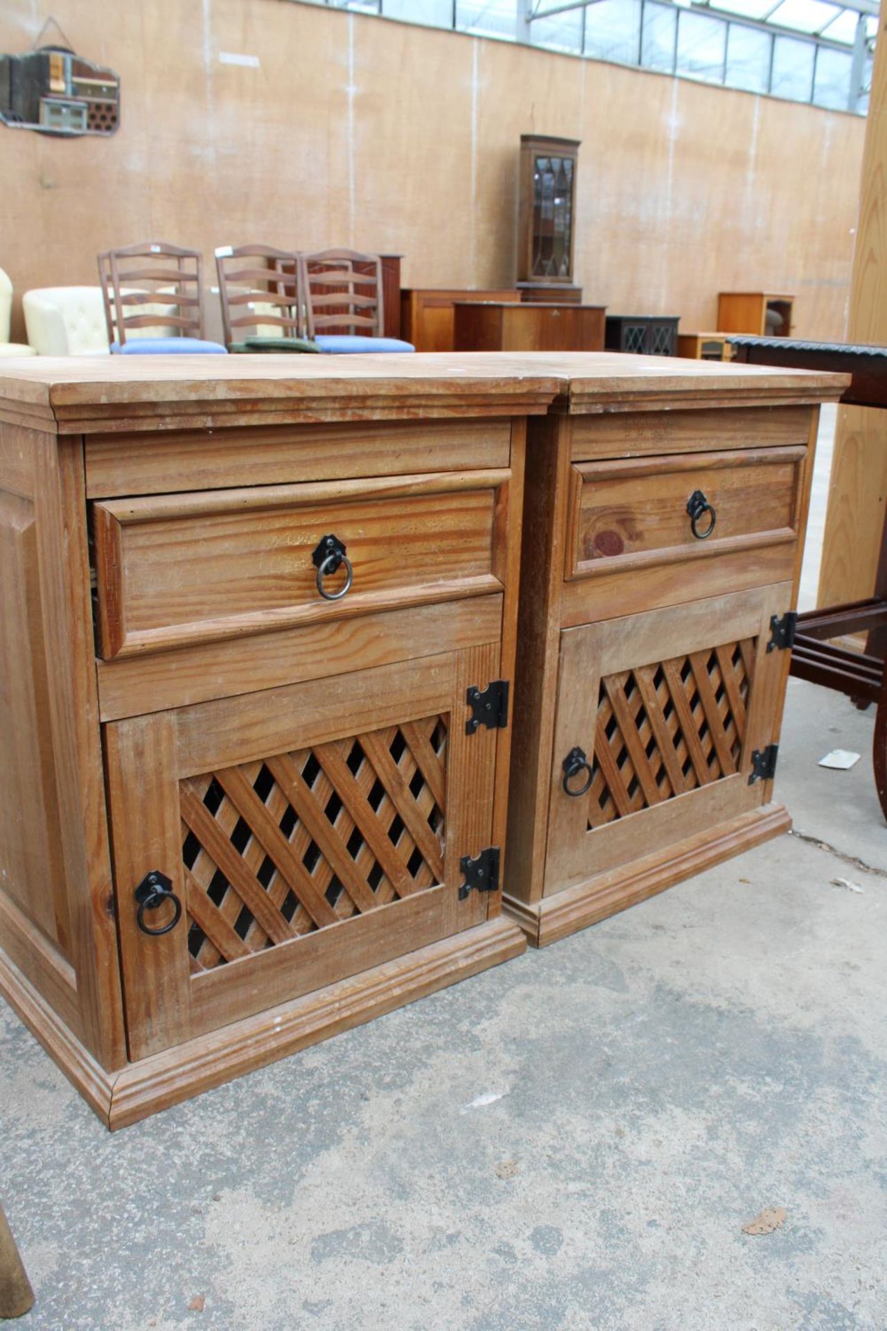 A PAIR OF MEXICAN PINE BEDSIDE CUPBOARDS WITH LATTICE WORK DOORS - Image 2 of 2