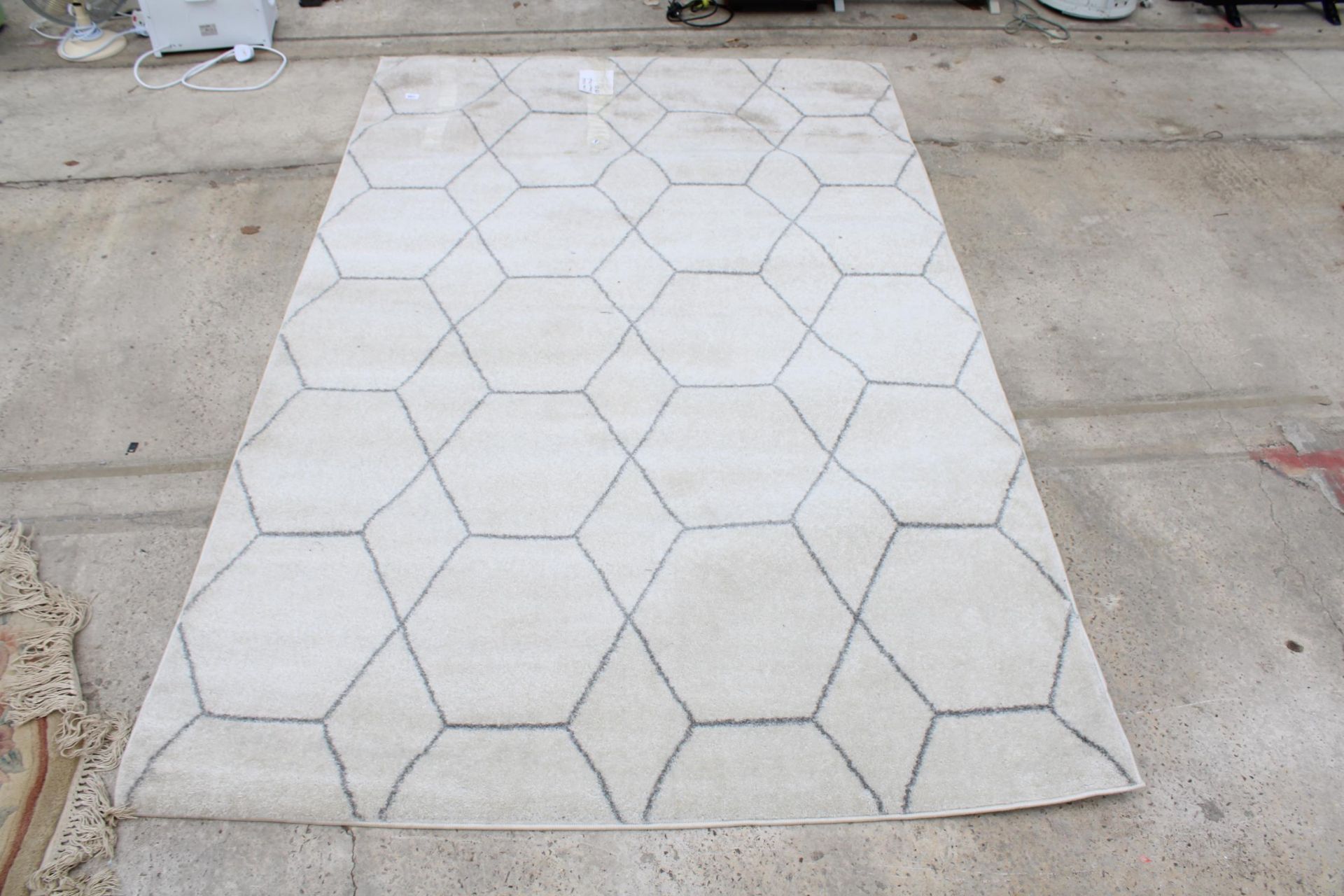 A MODERN GREY RUG