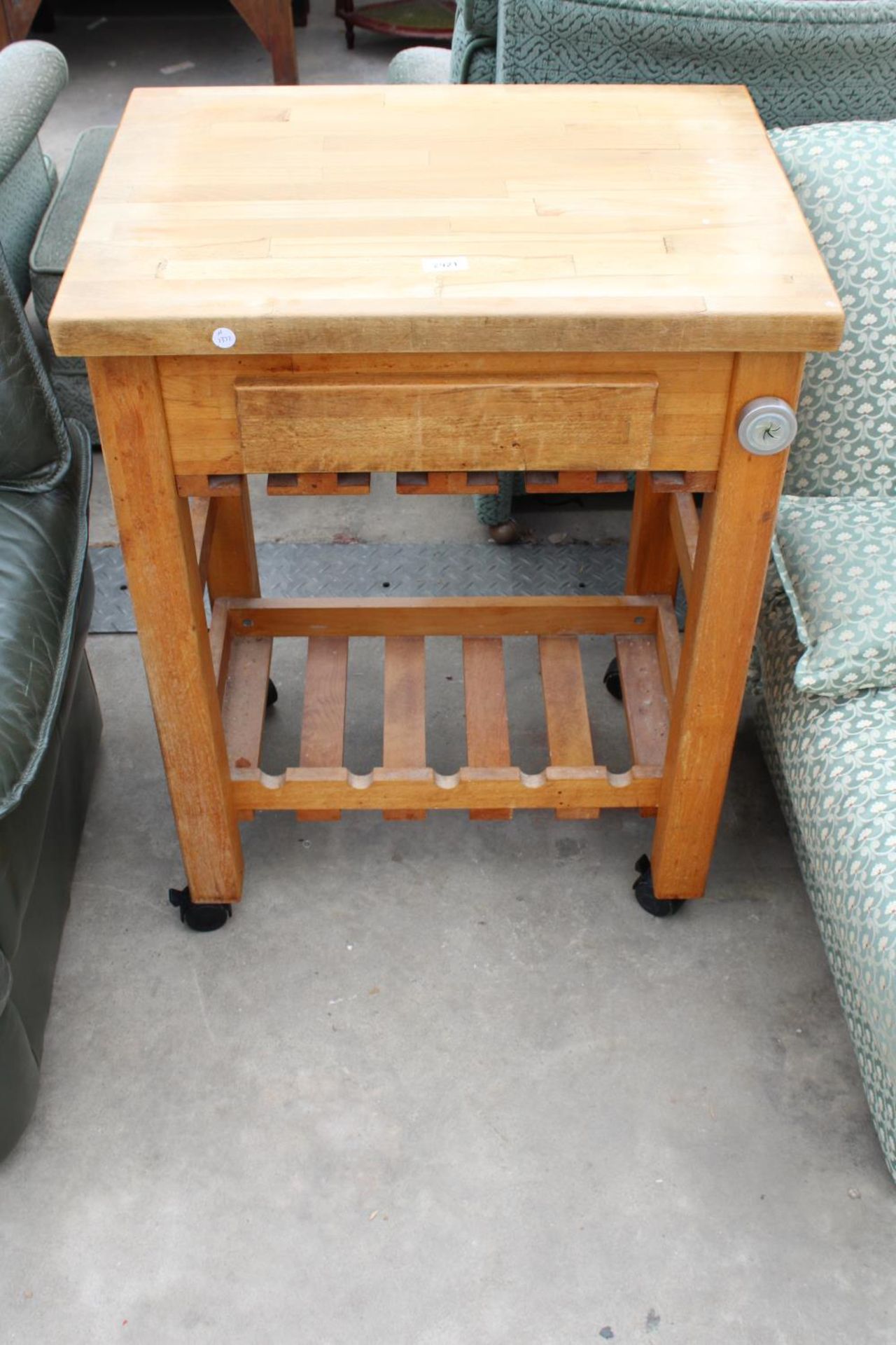 A MODERN KITCHEN WORK TABLE ON CASTERS WITH WOODBLOCK TOP WITH SINGLE DRAWER AND PULL-OUT SLIDE, 26"