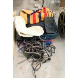 AN ASSORTMENT OF HORSE TACK TO INCLUDE HEAD COLLARS AND NUMBNERS ETC