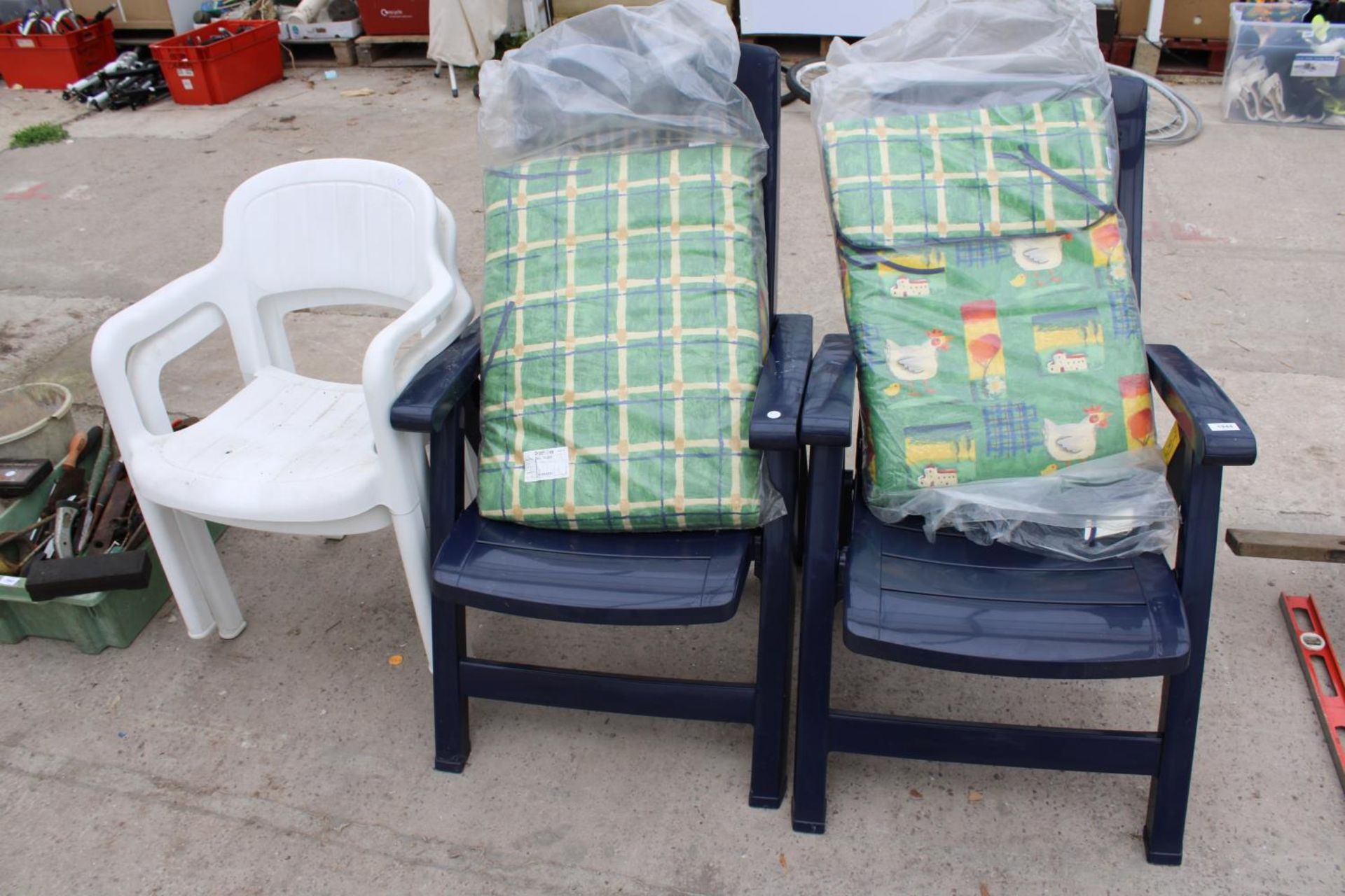TWO PLASTIC RECLINING CHAIRS AND TWO PLASTIC STACKING CHAIRS