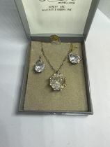 A SILVER EARRING AND NECKLACE SET IN A PRESENTATION BOX