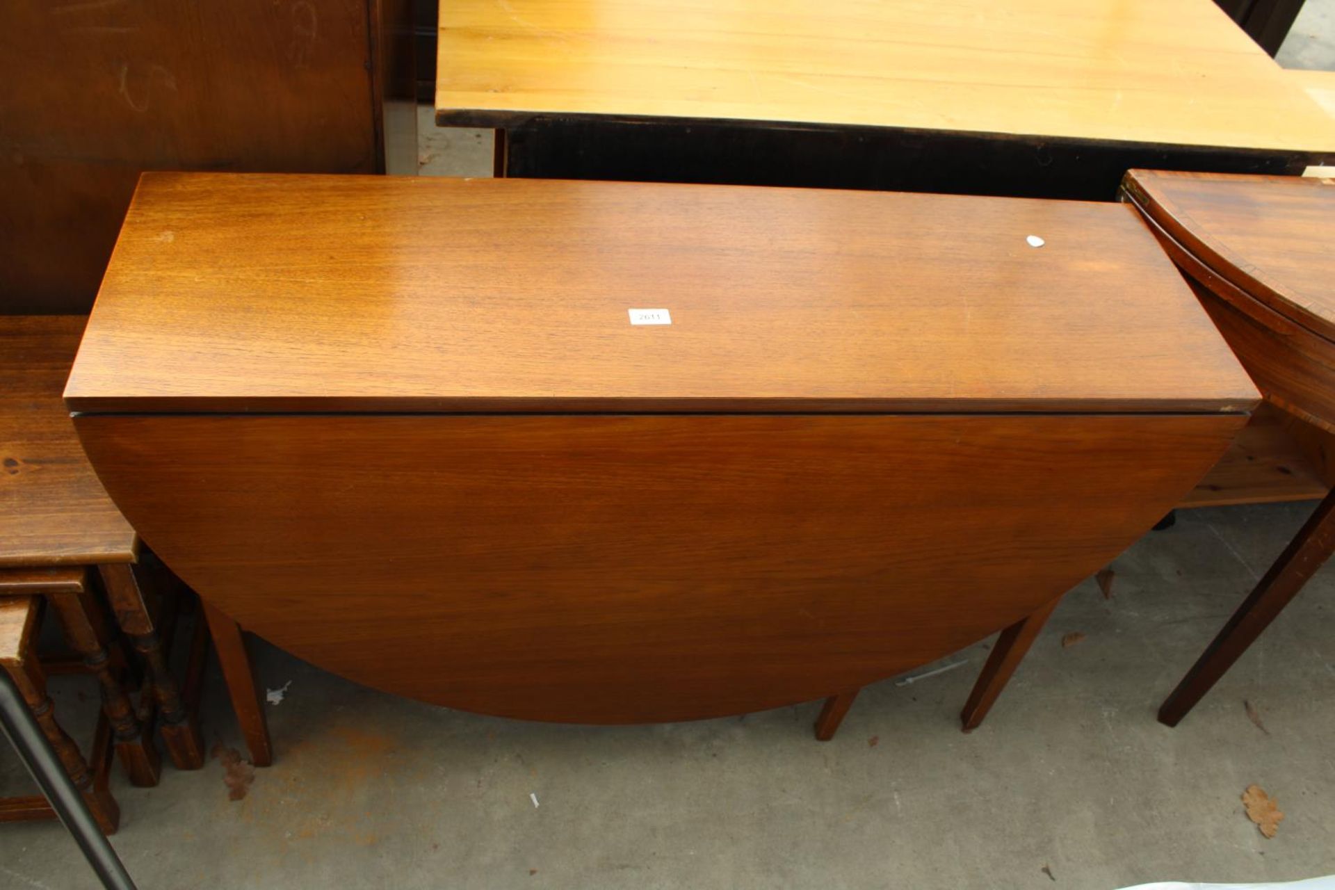 A RETRO TEAK GATE-LEG DINING TABLE, 57" X 45" OPENED