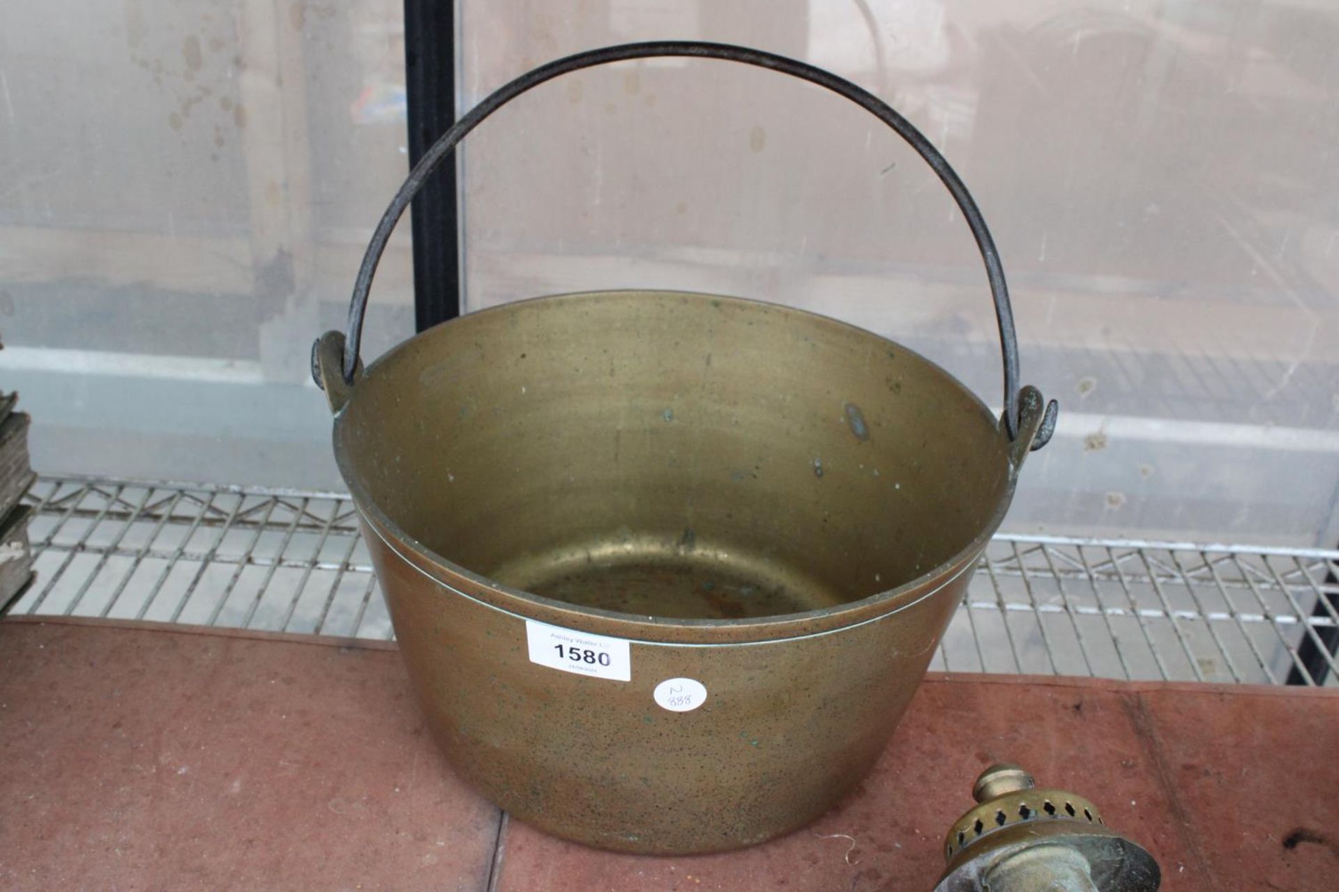 A VINTAGE BRASS JAM PAN WITH STEEL HANDLE